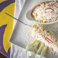 Esquite · Natural corn off the cob with cotija cheese, Mexican mayo sauce, and traditional tajin.