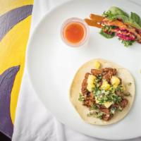 Al Pastor · Roasted natural pork, pineapple, cilantro, and red onion.