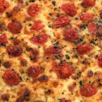 Pizza Con Pomodorini · Vegetarian Pizza with Mozzarella cheese, Cherry Tomatoes and Oregano.