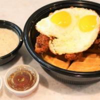 Dirty Bird* · A house-made golden waffle, topped with crispy buttermilk chicken tenders, two over-medium e...
