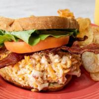 Pimento Cheese Club · Pimento cheese, all-natural nitrate free applewood bacon,
thin sliced tomato and lettuce ser...