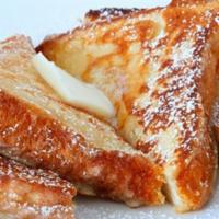 Honey French Toast · Thick-cut Texas-style bread dipped in vanilla scented batter, grilled until golden brown, to...