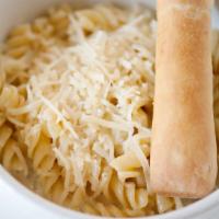 Kids Alfredo · Curly pasta tossed with a freshly made cream sauce and topped with Parmesan cheese.