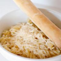Kids Buttery Noodles · Curly pasta with a touch of butter, topped with freshly grated Parmesan cheese.