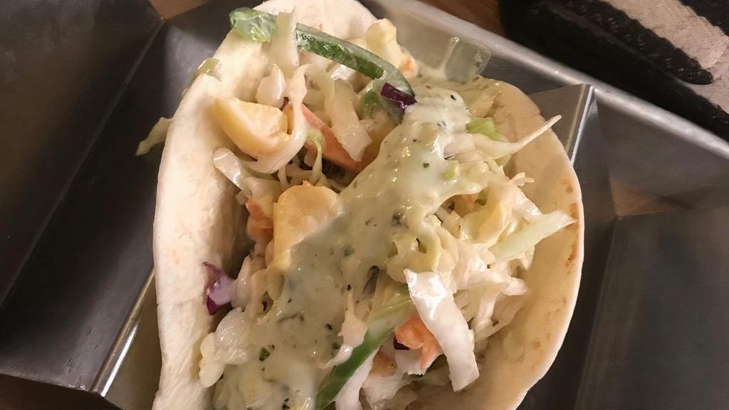 Buffalo Chicken Tacos · Grilled or Crispy chicken tenders tossed in a spicy cholula sauce topped with lettuce, blue cheese crumbles and ranch dressing.
