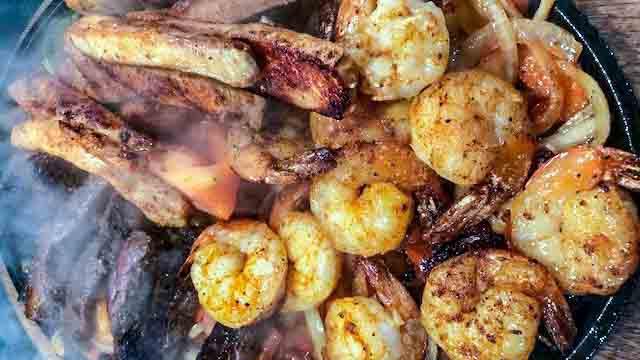 Chicken & Steak Fajitas · Grilled onions, peppers and tomatoes, lettuce, sour cream, guacamole, pico de gallo, rice, charro beans.