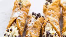 Cannoli · Vanilla cream filling, garnished with chocolate chips or pistachios.