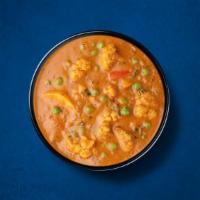 Assorted Veggie Curry · A combination of garden-fresh mixed vegetables simmered in tomato-based gravy, onion, and sp...
