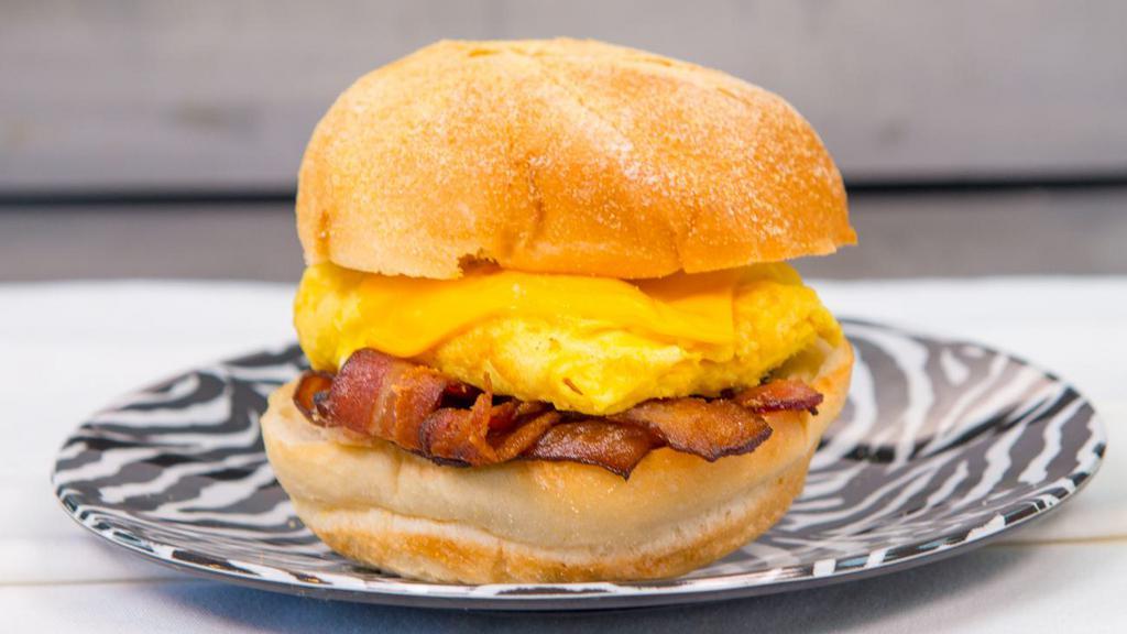 Bacon, Egg & Cheese Sandwich · Bacon strips, scrambled eggs, american cheese on kaiser roll.