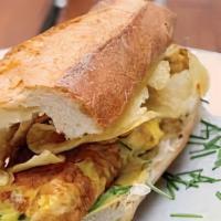 Omelet Sandwich · Scrambled eggs with choice of bacon, ham or sausage, and american cheese on 12' sub roll.