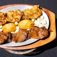 Chicken Grilled Skewers · Grilled chicken, cooked in a secret chef's marinade mix, served with grilled potatoes and Pe...