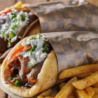Lamb Gyro · Served and filled up with slices of cooked lamb, marinated in spices wrapped fresh ingredien...