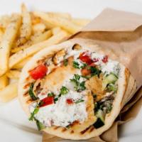 Chicken Pita · Served and filled up with slices of baked chicken, marinated in spices wrapped fresh ingredi...