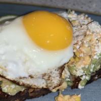 Avocado Toast With Egg · Avocado, Grilled Corn, Cotija Cheese, Spicy Mayo, Pickled Peppers, Cilantro, Multigrain Brea...