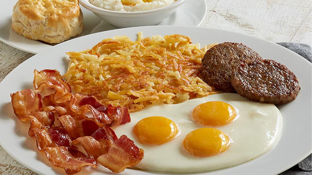 Smokehouse Platter · Applewood smoked bacon (3 strips) AND country sausage OR turkey sausage (2 patties) served with 3 Farm-Fresh eggs* cooked to order, crispy hashbrowns or seasonal fruit, and biscuit & sausage gravy OR homestyle grits & buttery toast or biscuit (Cal 935-1130)