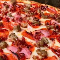 Meat Lovers Pizza · Pepperoni, Ground Beef, Ham, Peppers