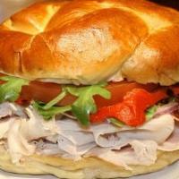 Turkey Twist · Smoked turkey, bacon, lettuce, tomato, onion, roasted red peppers, and mayonnaise on a warm ...