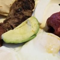Huevos Rancheros Con Carne Asada / Eggs Ran W/ Grilled Beef · 