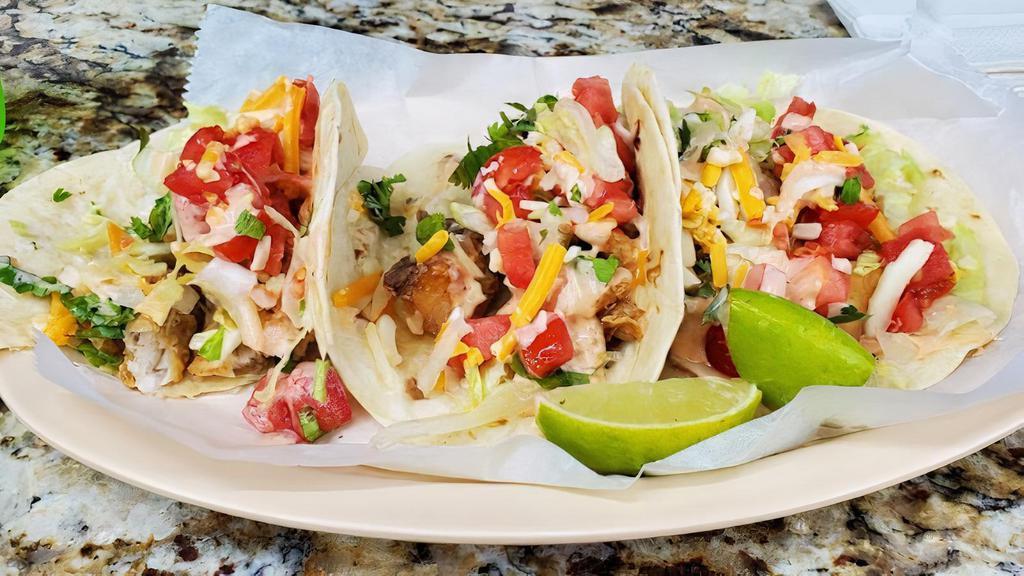 Chicken Chipotle Taco · Spicy. 3 pieces grilled chicken cubes cooked on our chipotle cream sauce, fresh tomatoes cilantro and served on flour tortillas.