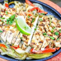 Grilled Chicken Fajitas · Sautéed bell peppers and onions, mix with juicy chicken strips, cooked over oak wood fire an...