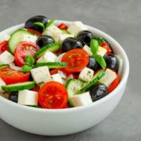 Greek Salad · Fresh mixed greens, crumbled feta, tomatoes, red onion, beets, garbanzo beans, Kalamata oliv...