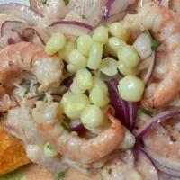 Ceviche De Pescado Y Camarones · Shrimp and raw fish marinated in lime juice.