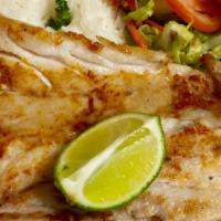 Filete De Corvina Frito O A La Plancha · Fried or grilled Corvina fillet served with fried yucca and rice.