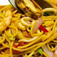 Tallarin Saltado De Mariscos · Pasta and seafood with sauteed onions and tomatoes.