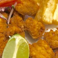 Huevera Frita Con Yuca Y Arroz · Fried fish roe served with fried yucca and rice.