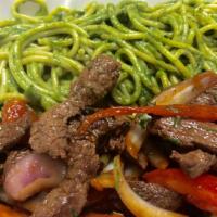 Tallarines Verdes Con Lomo Saltado · Pasta in Pesto Sauce with fine Steak pieces sautéed with onions and tomatoes