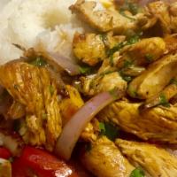 Pollo Saltado · Chicken pieces sautéed with onions and tomatoes served with fries and rice.