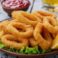 Fried Calamari Basket · Delicious, Fried Calamari served with customer's choice of sauce with a basket of crispy gol...