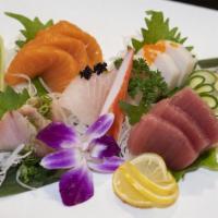 Sashimi Dinner · Served with miso soup and salad. 16 pieces of assortment of fresh raw seafood.