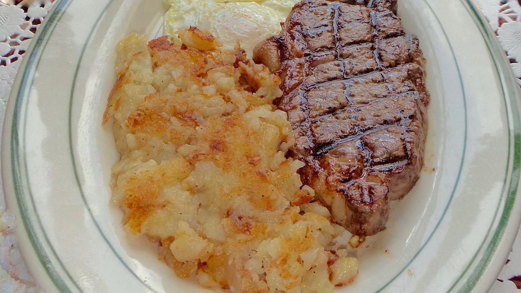 Angus Ny Strip Steak (10 Oz.) & Eggs · Any Style.

*May be cooked to order. Consuming raw or undercooked meat, poultry, seafood, shellfish or eggs may increase your risk of foodborne illnesses,
Especially if you have certain medical conditions.