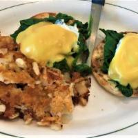Florentine Benedict · Two Poached Eggs with Spinach topped with Hollandaise Sauce on an English Muffin, served wit...
