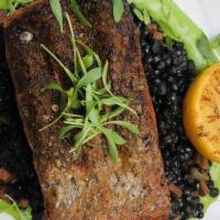 Salmon A La Plancha · Beluga black lentils, pea puree.