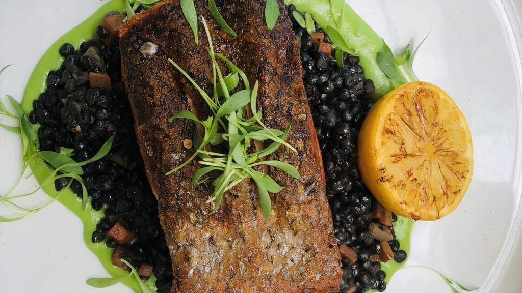 Salmon A La Plancha · Beluga black lentils, pea puree.