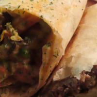 Philly Burrito · Grilled chopped steak, grilled onion, bell pepper and cheese sauce.
