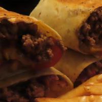 Cheeseburger Burrito · Seasoned ground beef,cheese, lettuce,fries,tomatoes, grilled onions and peppers.