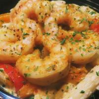 Shrimp Alfredo Pasta Bowl · Succulent shrimp, bell pepper and onion on a bed of penne pasta in a creamy alfredo sauce.