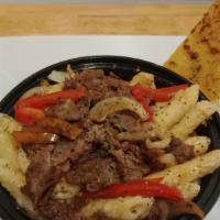 Philly Pasta Bowl · Philly beef, onion, bell pepper on a bed of penne pasta in a creamy alfredo sauce.