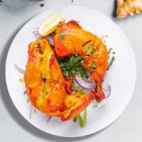 Chicken Tandoori · Grilled on the bone dark meat chicken marinated with yogurt, lemon juice, and special tondoo...