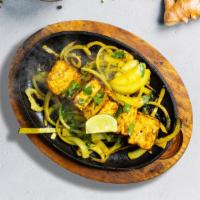 Paneer Tikka · Fresh cubes of cottage cheese marinated in yoghurt and baked in a tandoor clay oven
