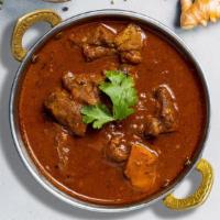 Lamb Vindaloo · Juicy lamb cooked in a spicy pungent curry with potatoes. Served with aromatic basmati rice ...