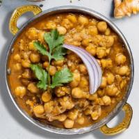 Chana Masala · Chickpeas cooked in a tomato and onion gravy with Indian spices.