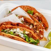 The Kw Tacos · 480 cal. Tender, slow-cooked beef short rib tacos, stuffed with shredded mozzarella cheese, ...