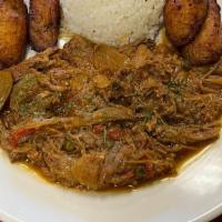 Ropa Vieja / Pulled Flank Steak · Cooked in red wine tomato sauce, onions, bell peppers, olives and spices.