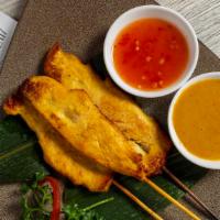 Chicken Satay · Thai-style grilled marinated chicken with peanut sauce and sweet chili.