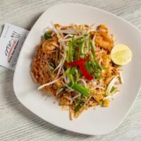 Shrimp Pad Thai · Sauteed rice noodles with shrimp, eggs, bean sprouts, scallions and fried tofu topped with g...