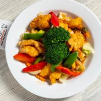 Thai Chili Fish · Crispy white fish with chili sauce, onions, bell peppers, basil leaves served with mixed veg...